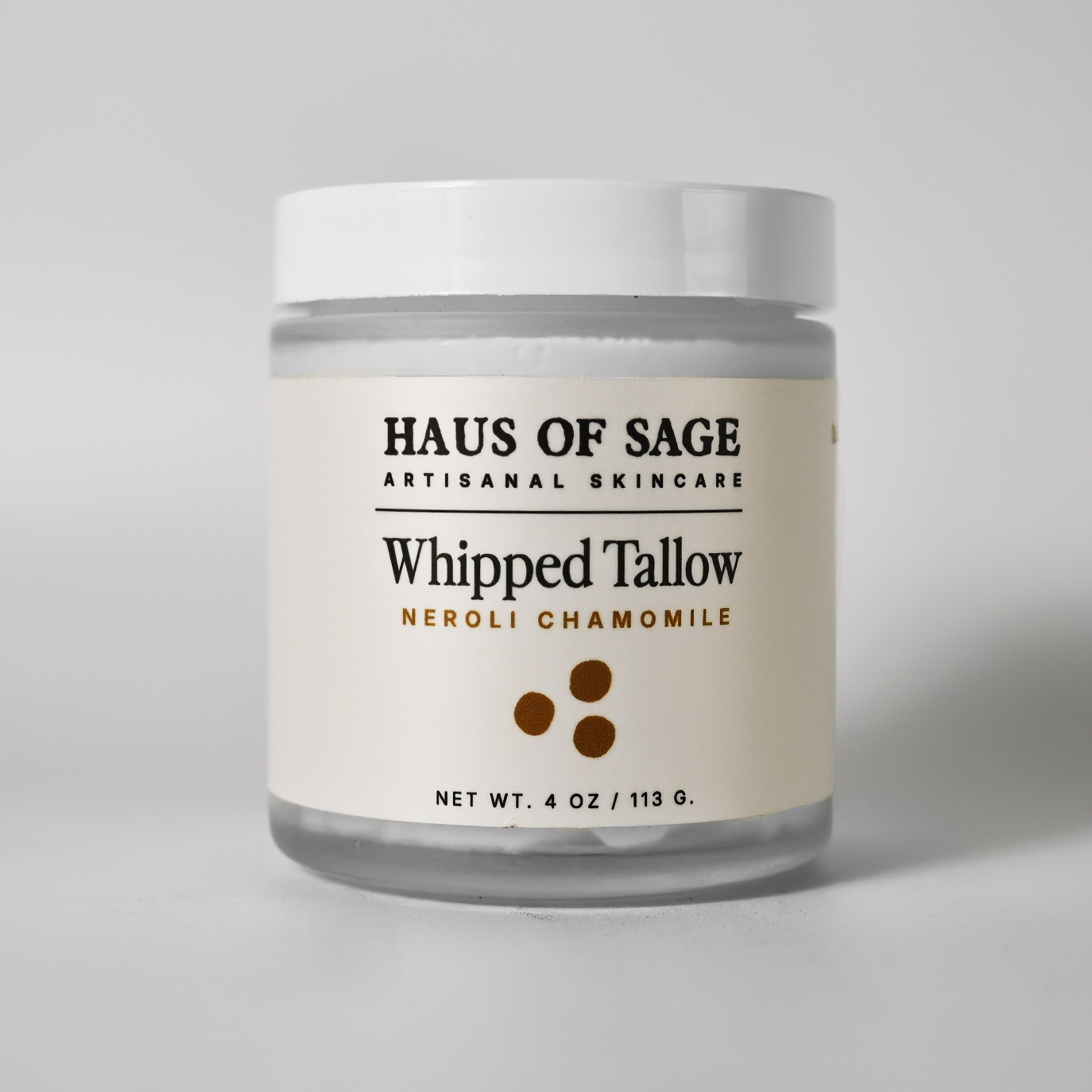 Jar of Haus of Sage Whipped Tallow on a gray background