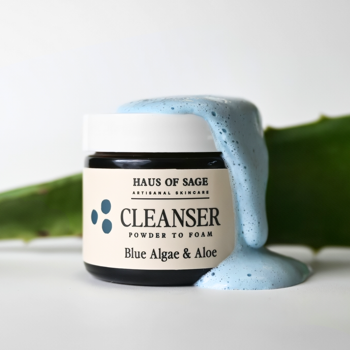Haus of Sage cleanser jar with blue foam on a white background