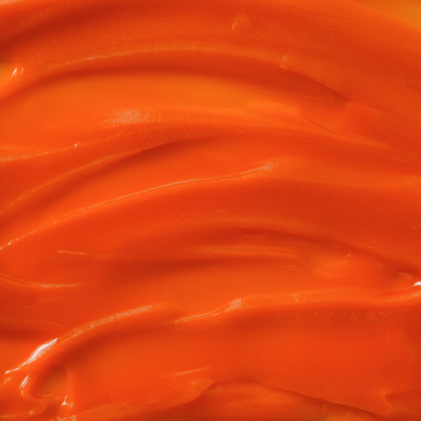 Close-up of orange antioxidant creme 