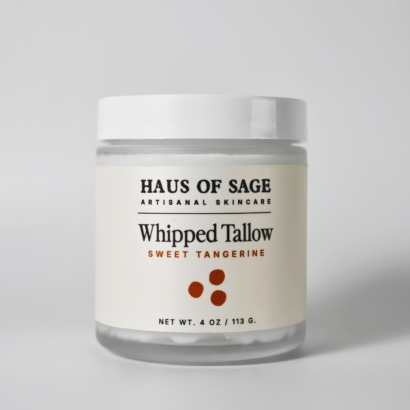 Jar of Haus of Sage Whipped Tallow Sweet Tangerine on a light gray background