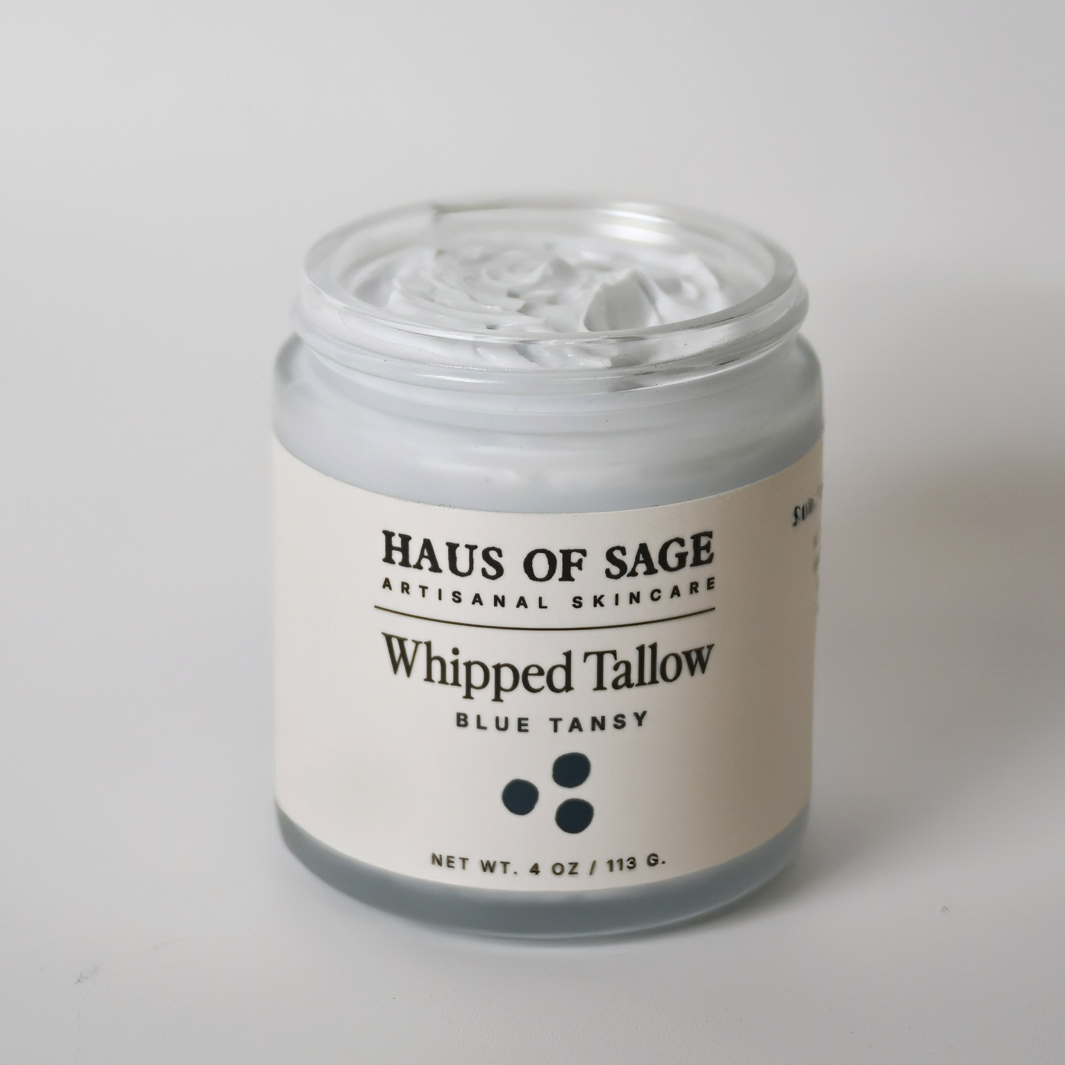 Jar of Haus of Sage whipped tallow on a white background