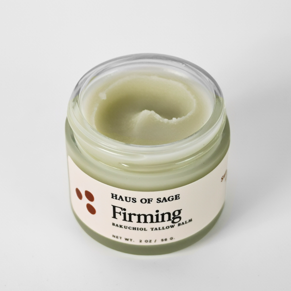 Top view of an open jar of 'Haus of Sage Firming Bakuchiol Tallow Balm'.